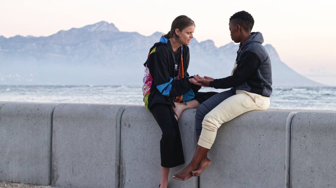 A student in Cape Town prays with a young woman struggling with anxiety.